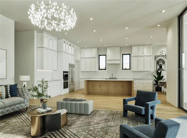 a living room with furniture and a chandelier