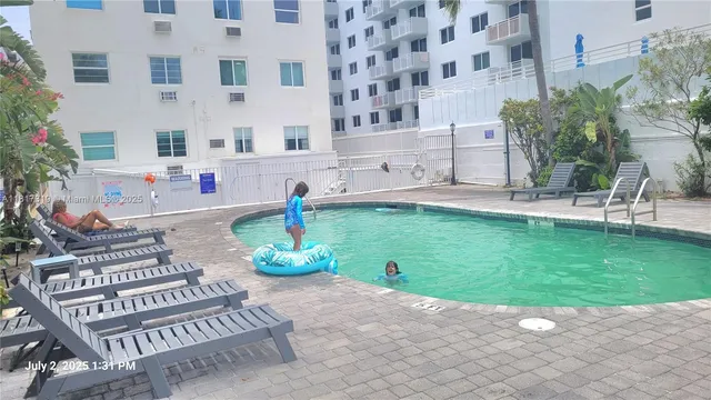 a front view of a building with garden