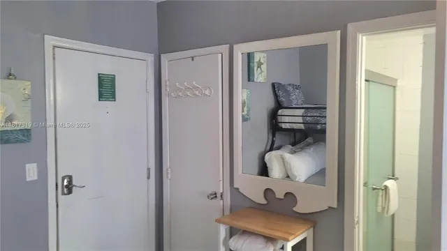 a bathroom with a shower and a sink