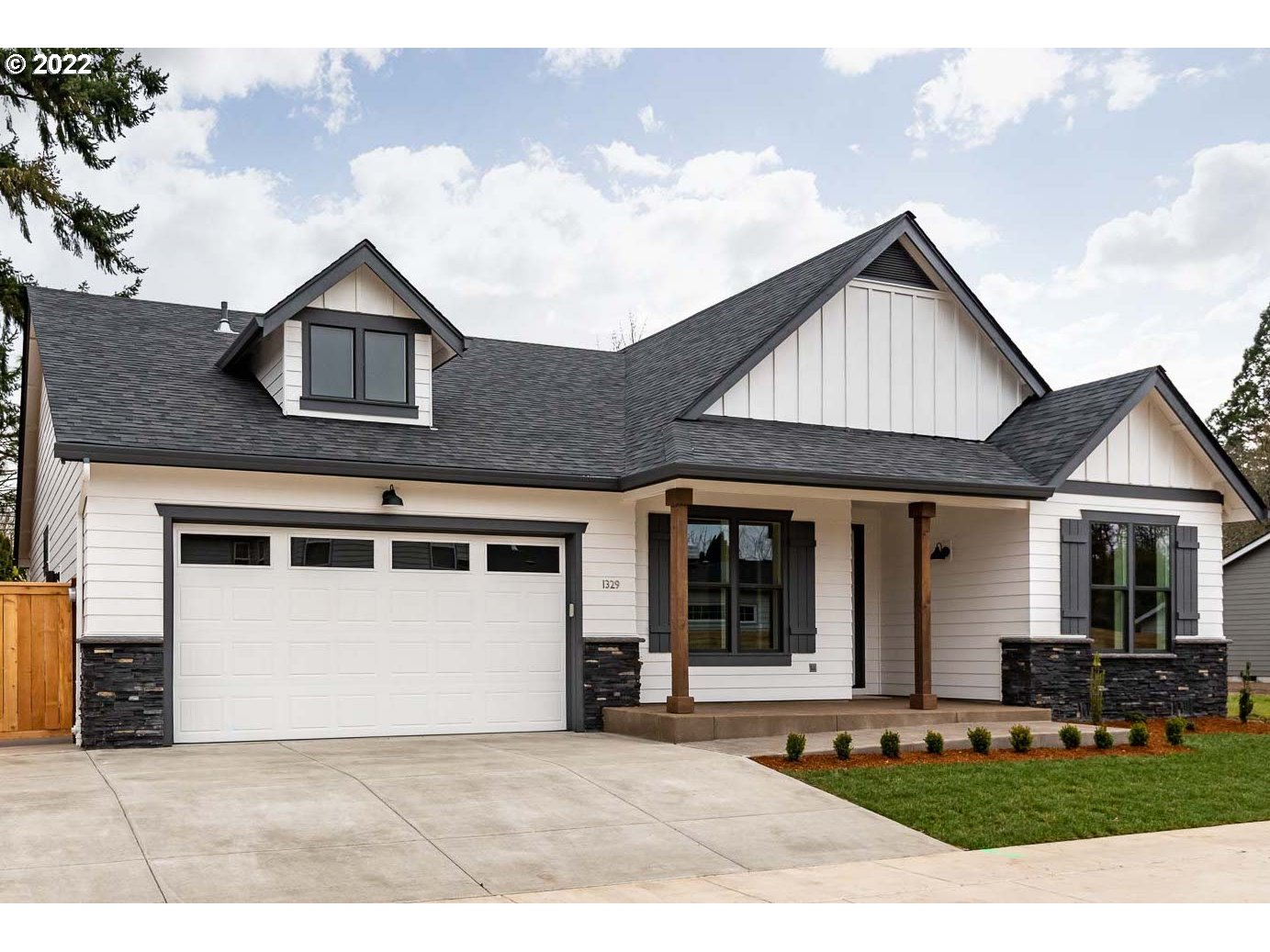 1017 South 33rd Street Springfield, OR 97478 - Photo 1 of 32 a front view of a house with a yard and garage