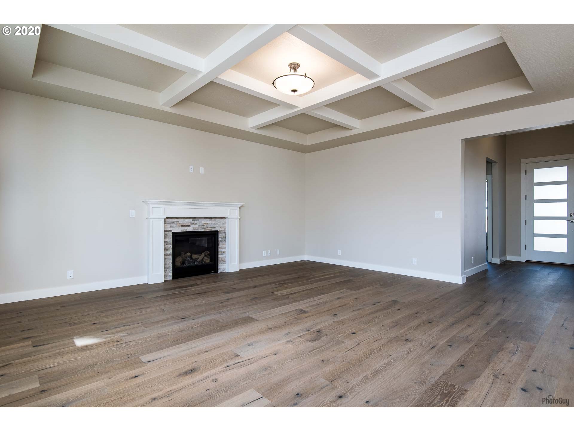 1017 South 33rd Street Springfield, OR 97478 - Photo 5 of 32 a view of an empty room with wooden floor and a window