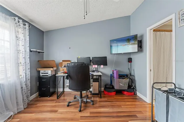 a view of a workspace with furniture and workspace