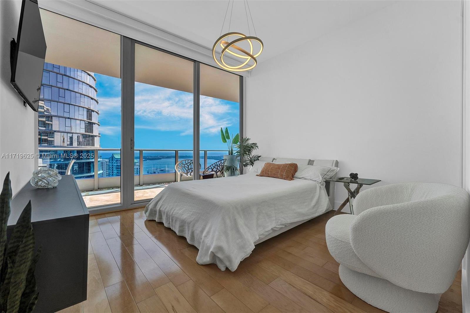 200 Biscayne Blvd Way, Unit 5001 Miami, FL 33131 - Photo 11 of 48 a bedroom with double vanity and a large window