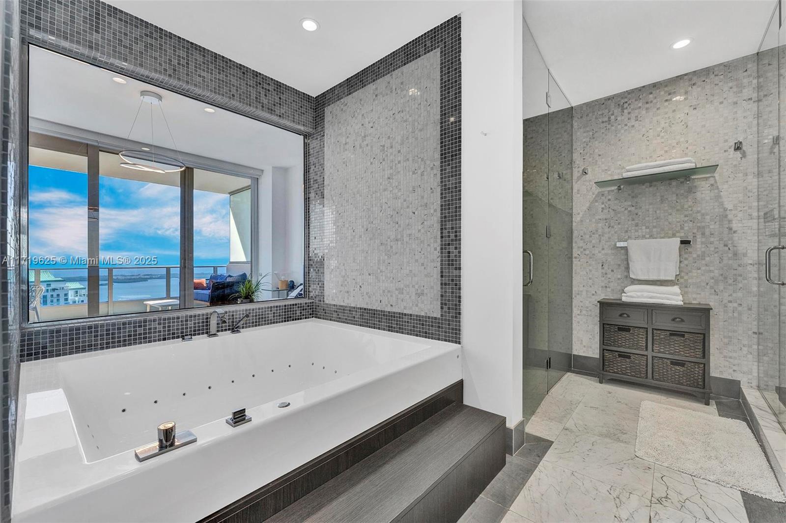 200 Biscayne Blvd Way, Unit 5001 Miami, FL 33131 - Photo 13 of 48 a bathroom with a bathtub and a sink