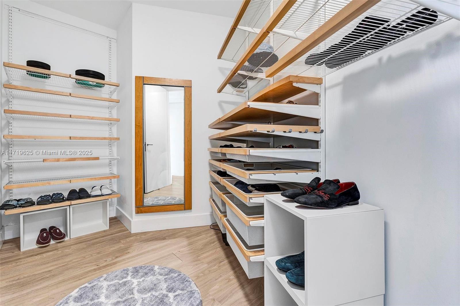 200 Biscayne Blvd Way, Unit 5001 Miami, FL 33131 - Photo 14 of 48 a view of walk in closet with clothes and shoes