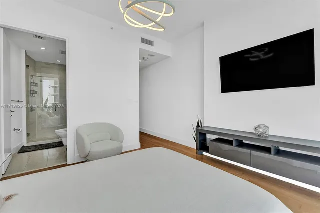 a bedroom with a bed and a fireplace