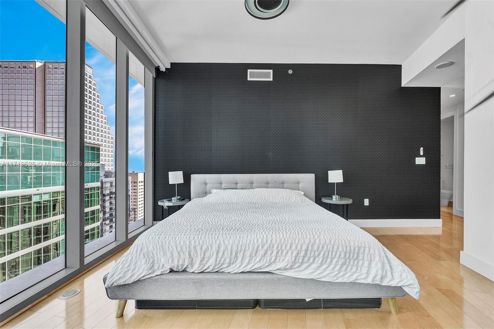 200 Biscayne Blvd Way, Unit 5001 Miami, FL 33131 - Photo 18 of 48 a bedroom with a bed and window