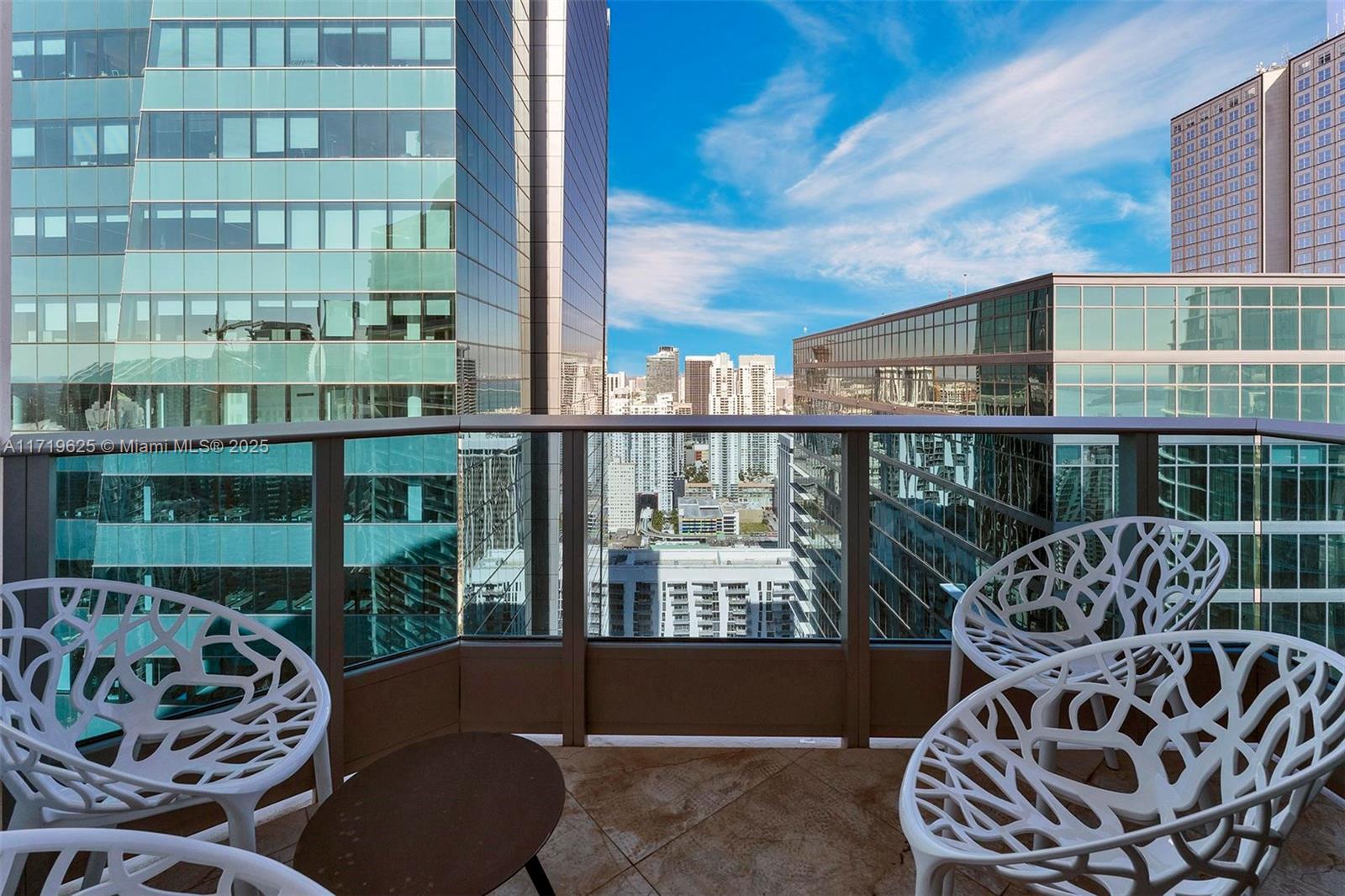 200 Biscayne Blvd Way, Unit 5001 Miami, FL 33131 - Photo 34 of 48 a balcony with furniture and a potted plant