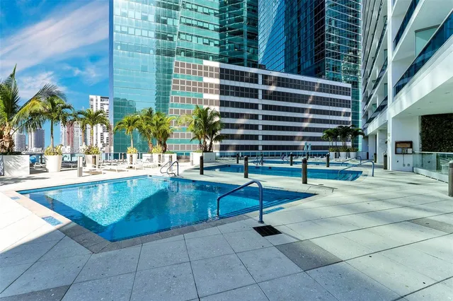 a work room with furniture and a flat screen tv