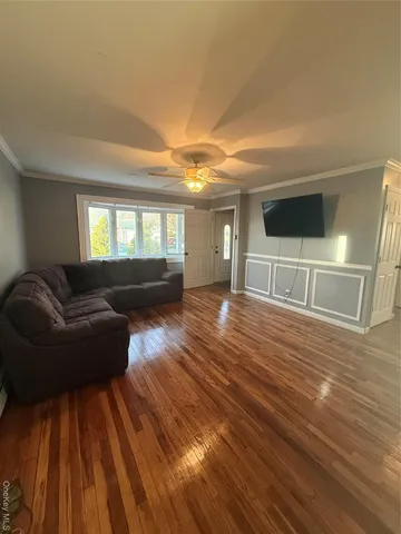 a living room with a couch and a flat screen tv