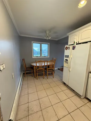 a room with chairs and white walls