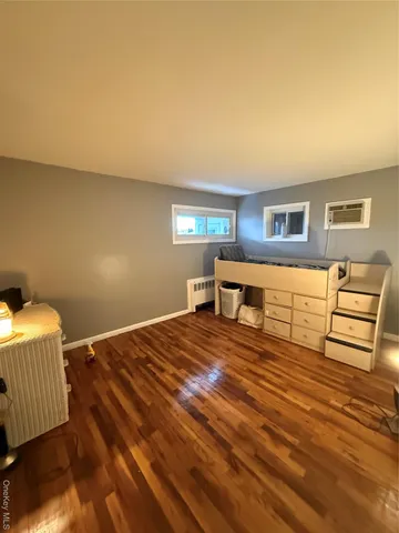 a bedroom with a bed and a cabinets