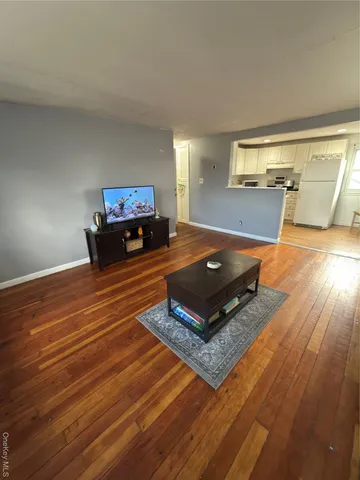 a living room with furniture pool and a table
