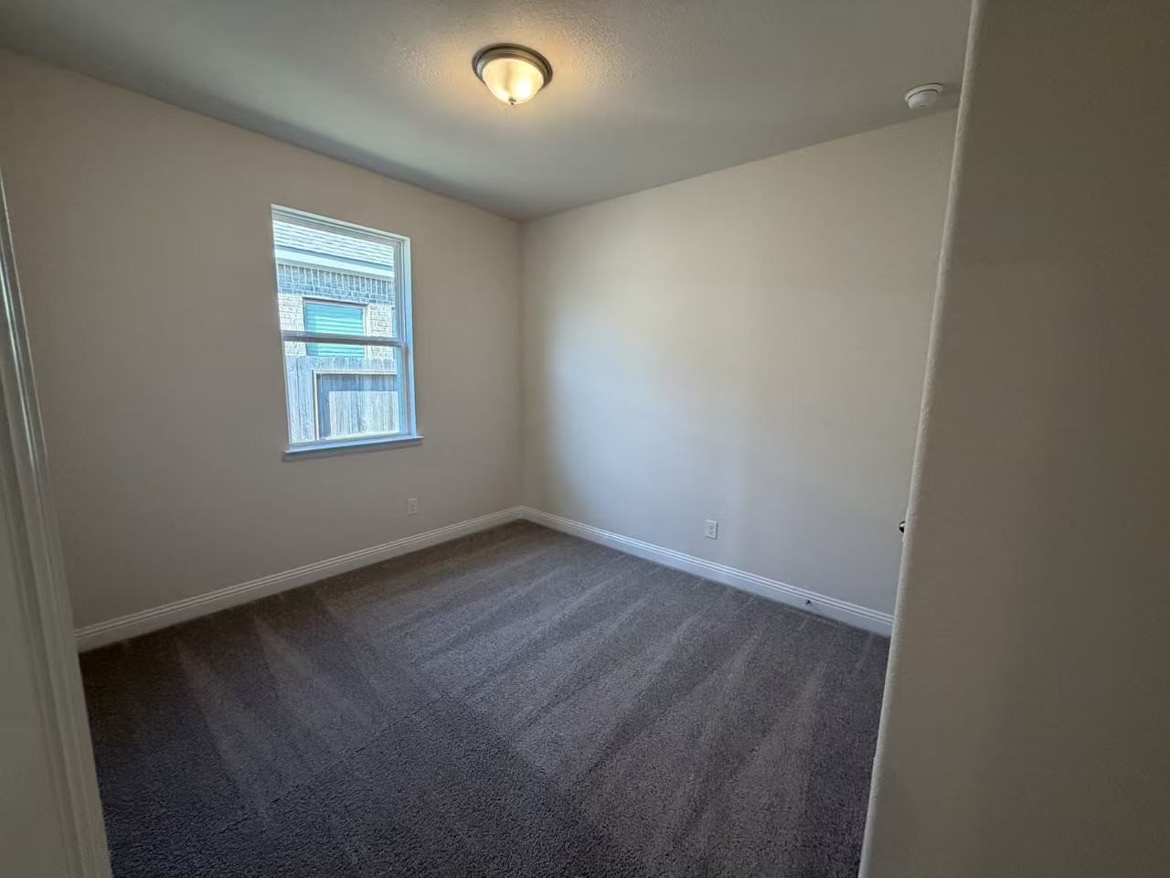 4014 Colony Lane Missouri City, TX 77459 - Photo 12 of 40 an empty room with a window
