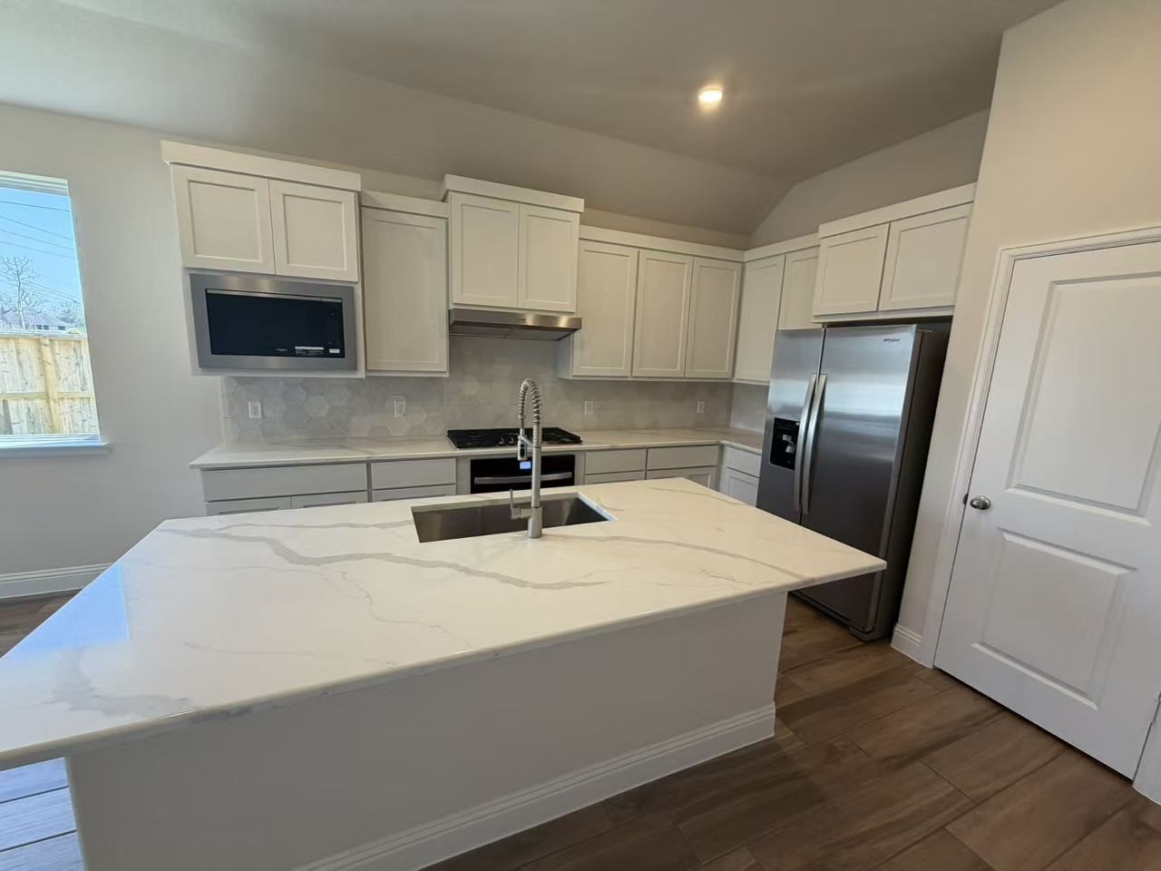 4014 Colony Lane Missouri City, TX 77459 - Photo 14 of 40 a kitchen with stainless steel appliances a refrigerator sink and microwave