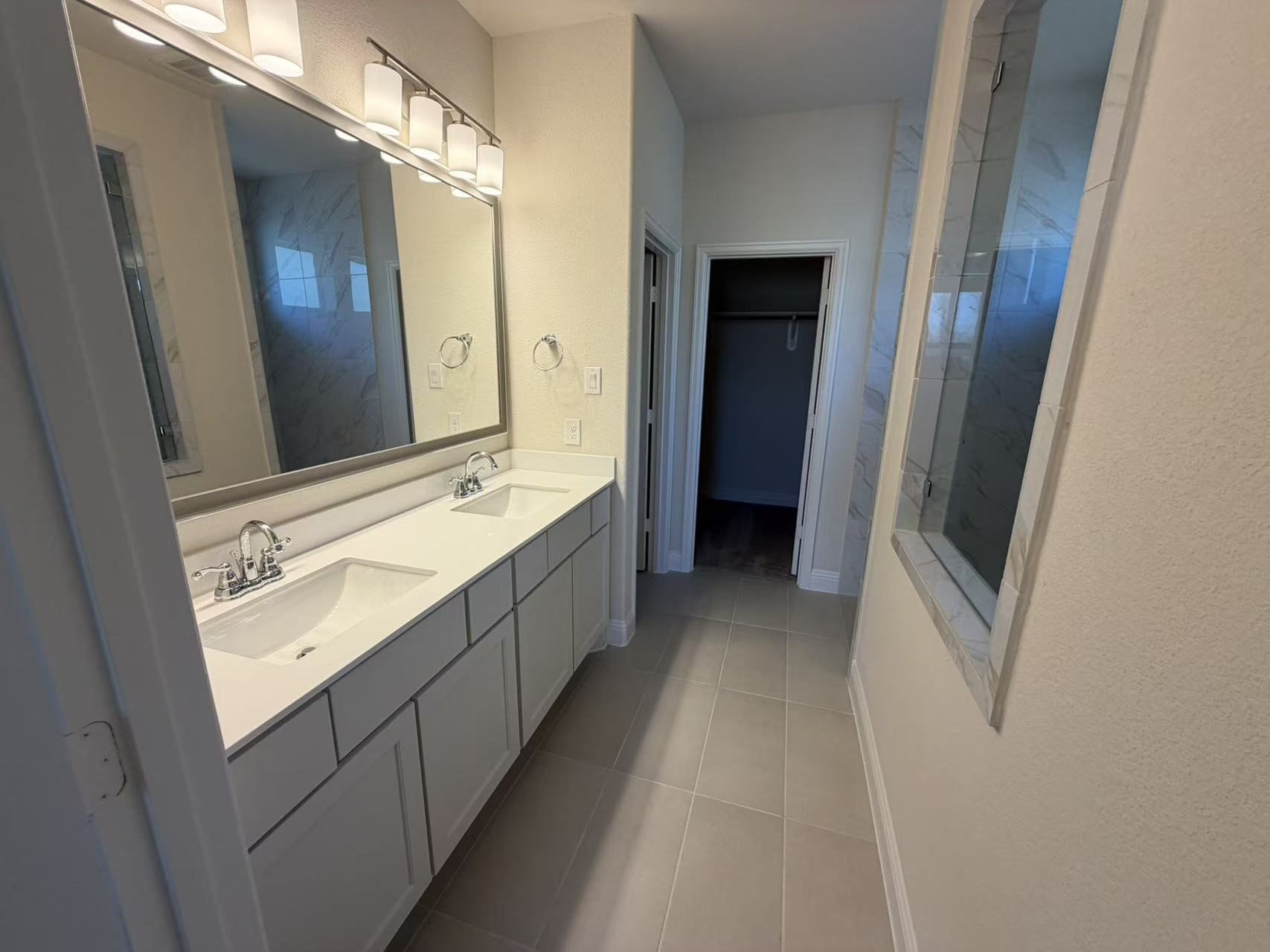 4014 Colony Lane Missouri City, TX 77459 - Photo 26 of 40 a bathroom with a double vanity sink and mirror