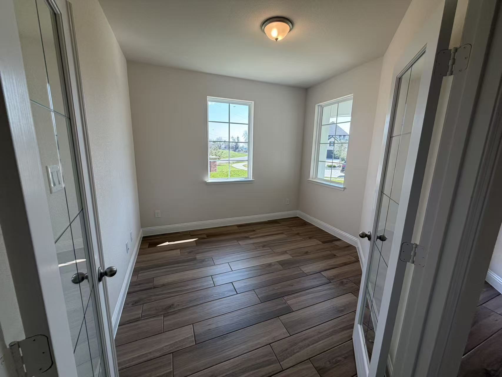 4014 Colony Lane Missouri City, TX 77459 - Photo 10 of 40 a view of an empty room with wooden floor and a window