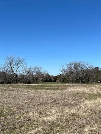 a view of a lake with a yard