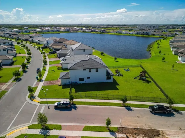 an aerial view of a yard with swimming pool