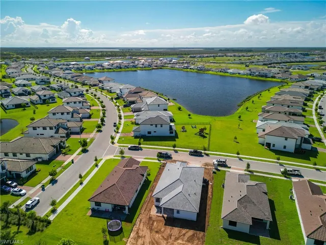 an aerial view of a swimming pool patio and outdoor seating