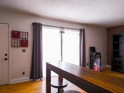 a room with furniture and wooden floor