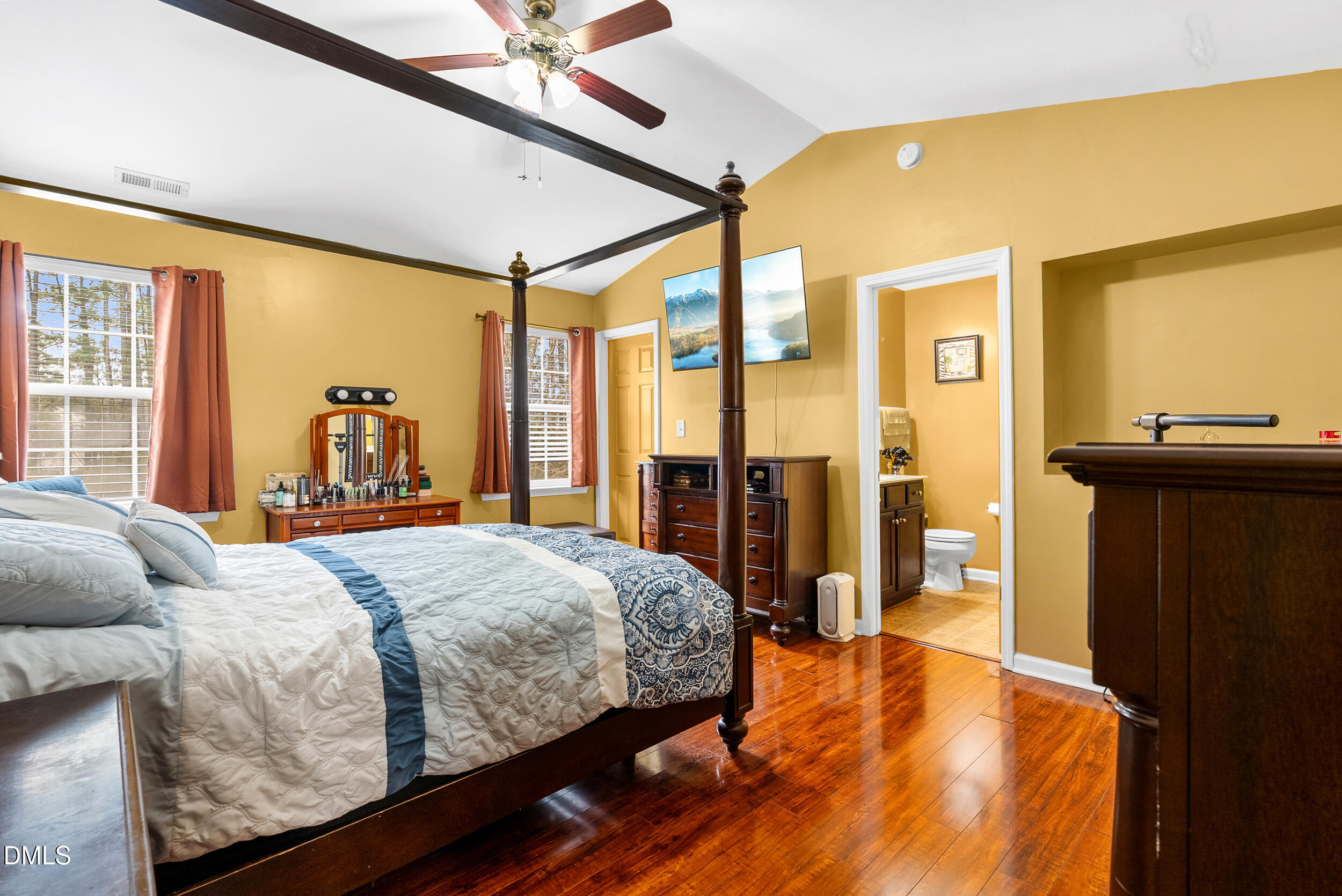 8840 Thornton Town Place Raleigh, NC 27616 - Photo 13 of 24 a bedroom with a bed and large windows