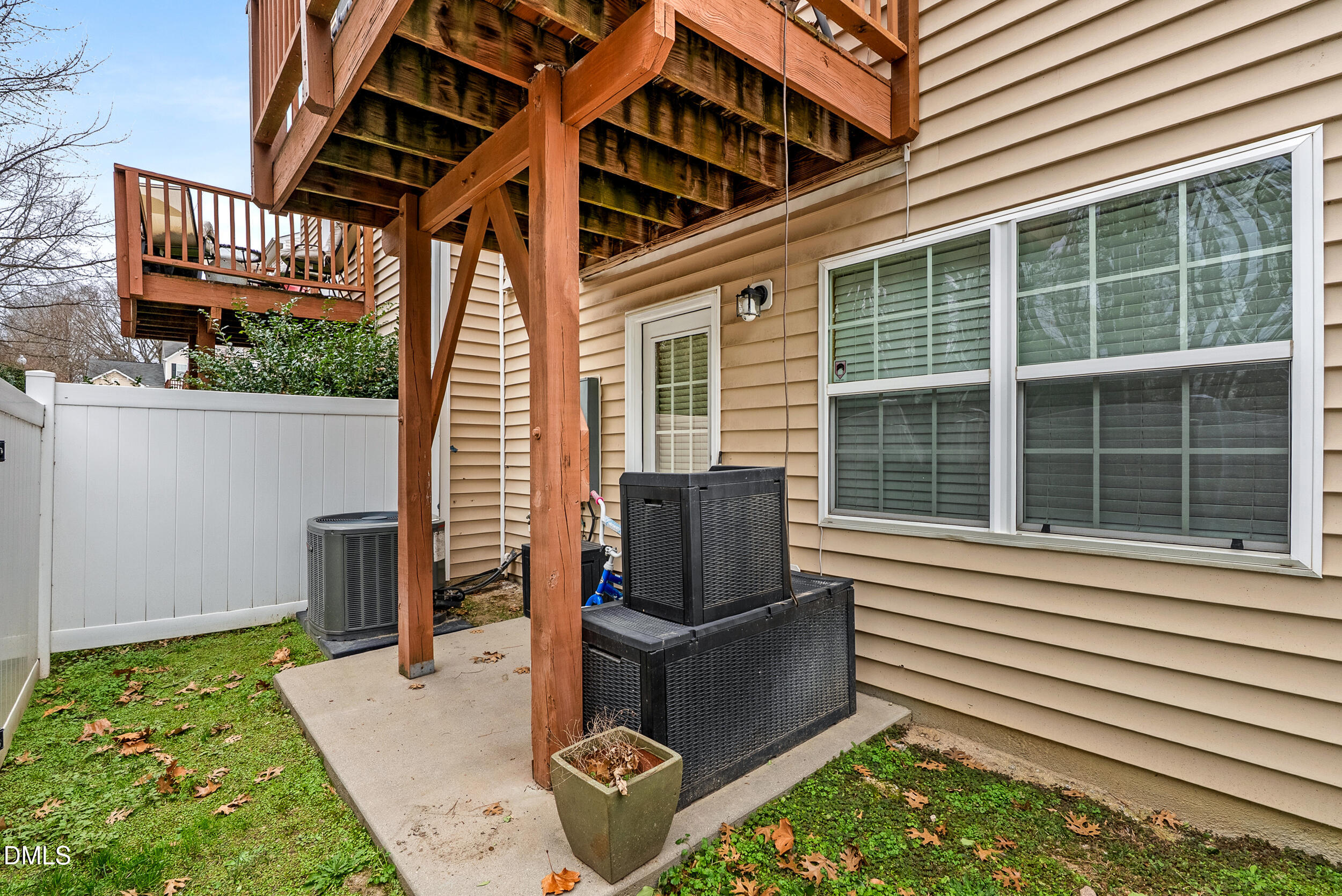 8840 Thornton Town Place Raleigh, NC 27616 - Photo 18 of 24 a porch with a bench next to a yard