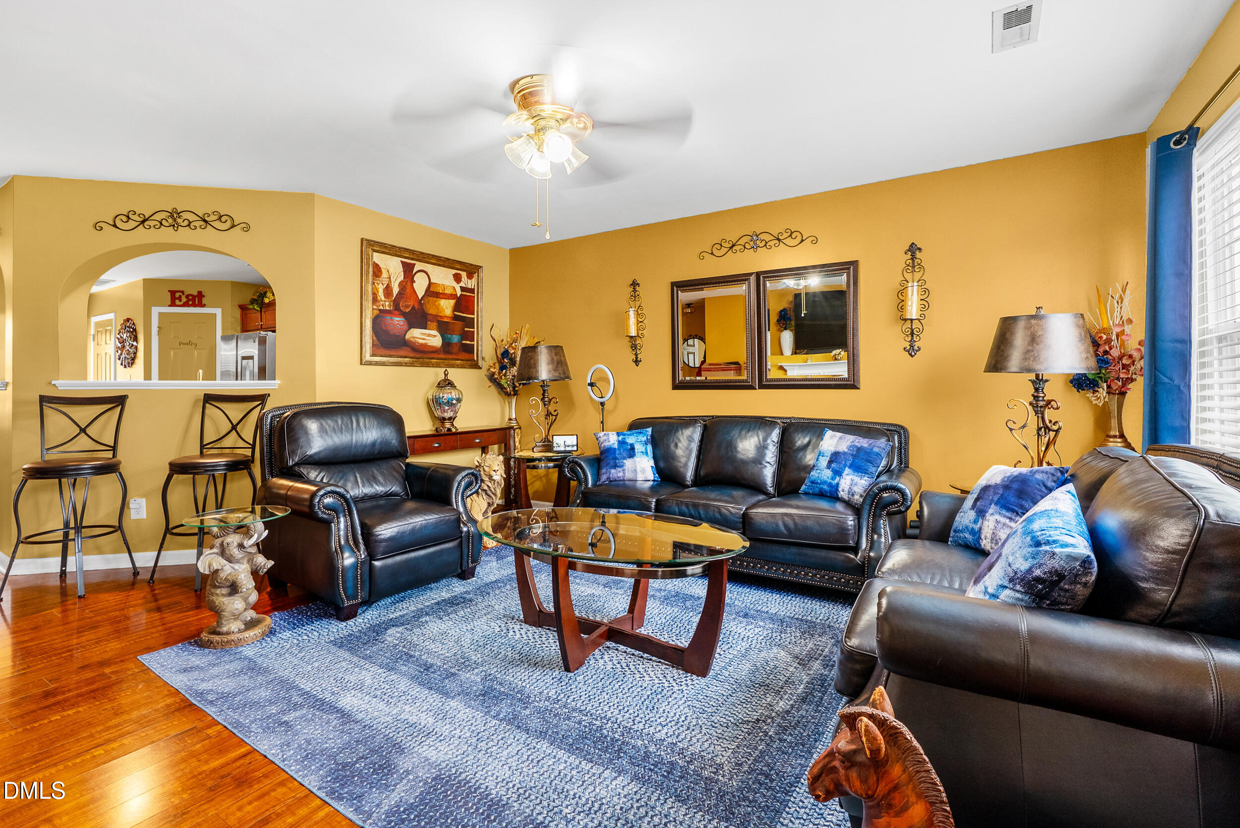 8840 Thornton Town Place Raleigh, NC 27616 - Photo 6 of 24 a living room with furniture and a wooden floor