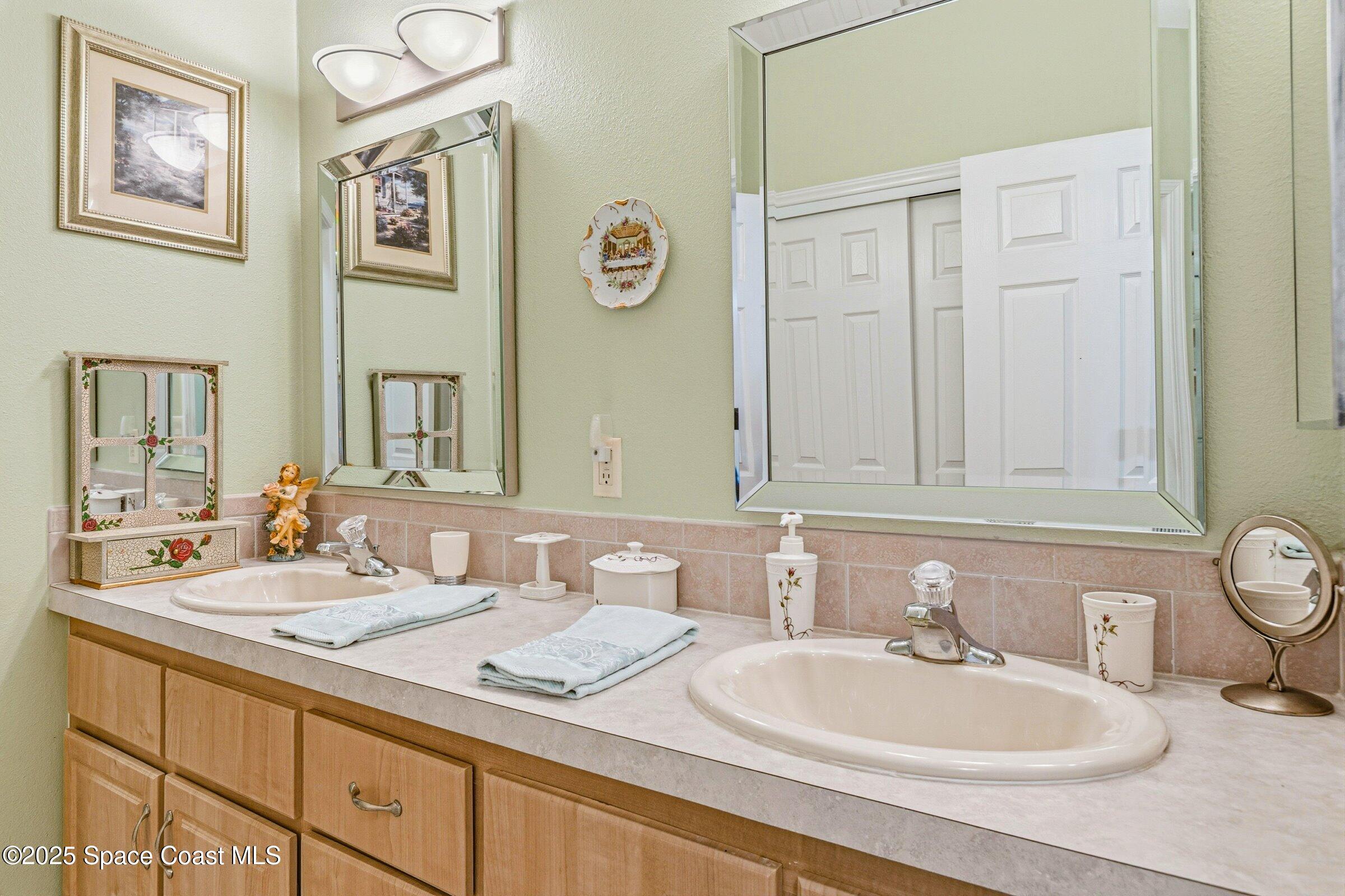 595 Outer Drive, Unit 129 Cocoa, FL 32926 - Photo 15 of 49 a bathroom with a sink and a mirror