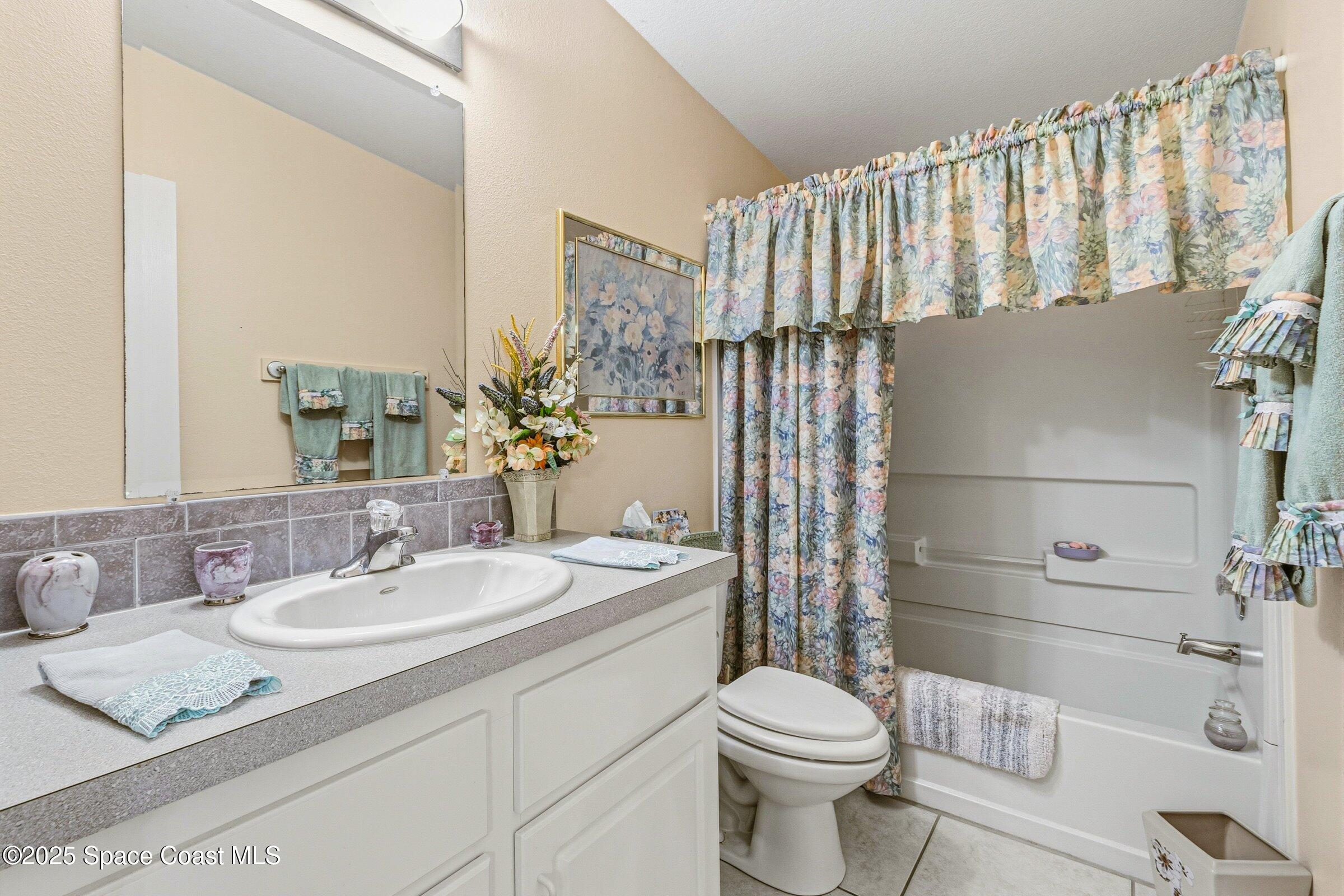 595 Outer Drive, Unit 129 Cocoa, FL 32926 - Photo 17 of 49 a bathroom with a sink toilet and shower