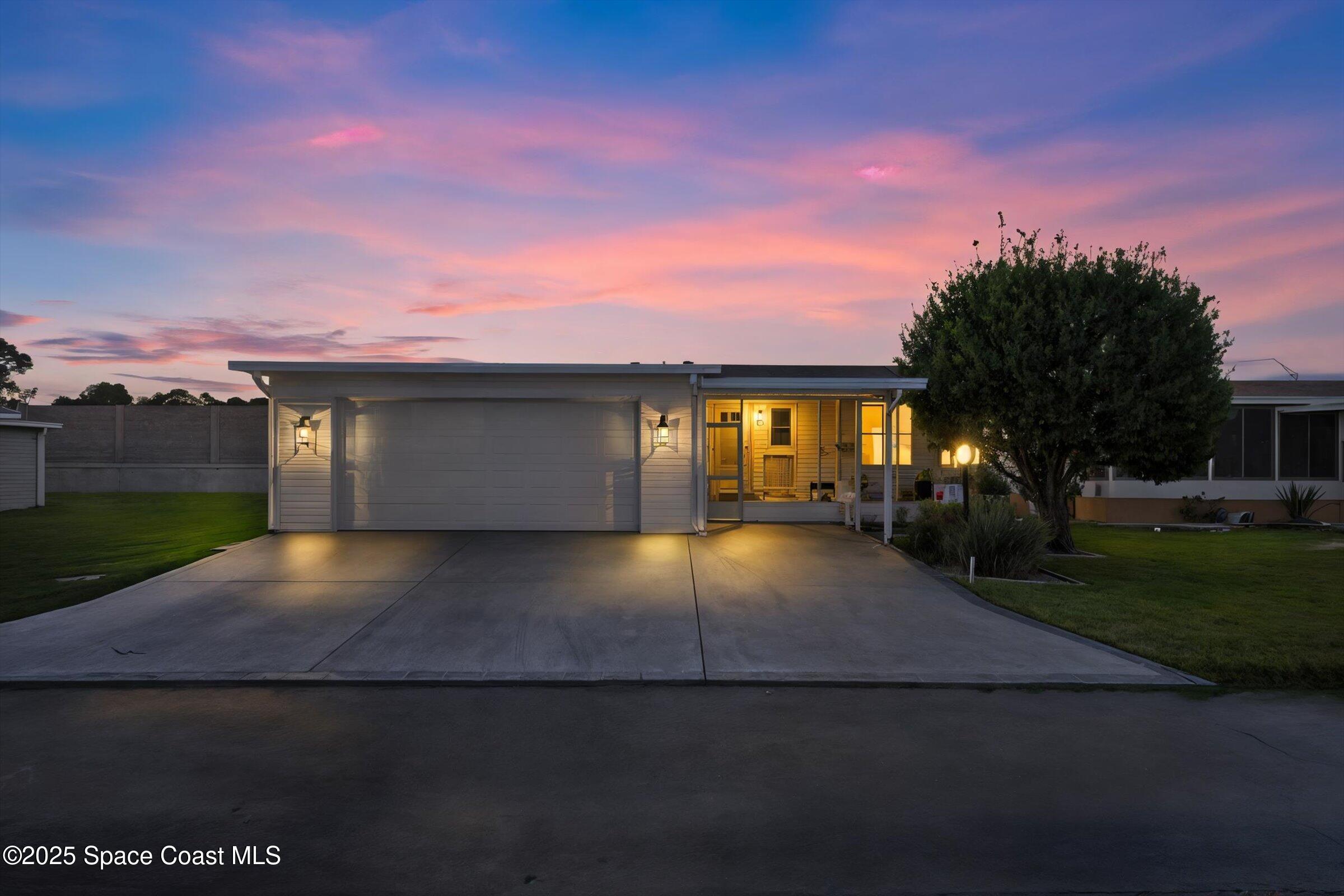 595 Outer Drive, Unit 129 Cocoa, FL 32926 - Photo 2 of 49 a view of house with yard