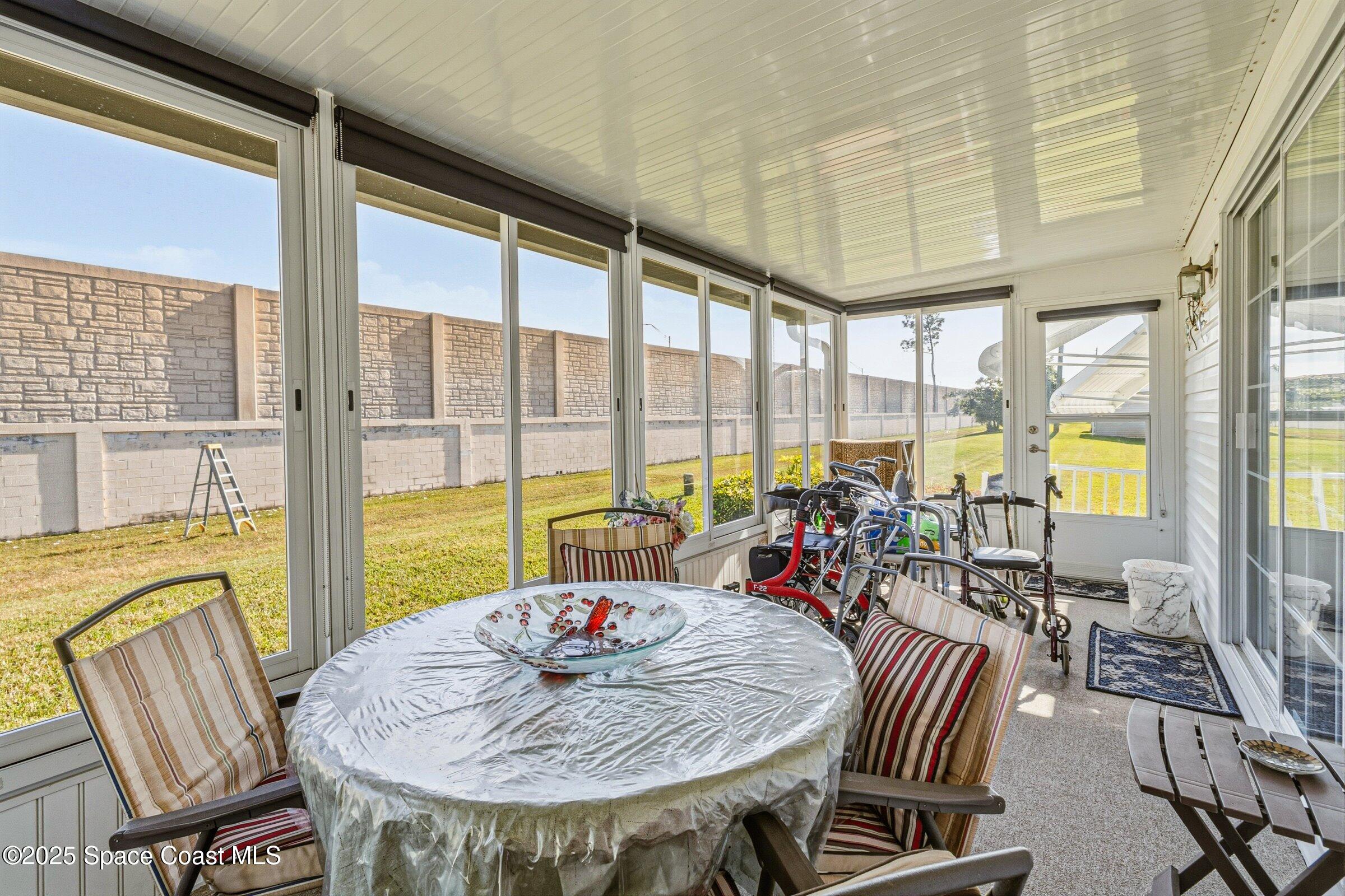 595 Outer Drive, Unit 129 Cocoa, FL 32926 - Photo 25 of 49 a view of a dining room with furniture window and outside view