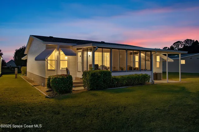a view of swimming pool from a big yard