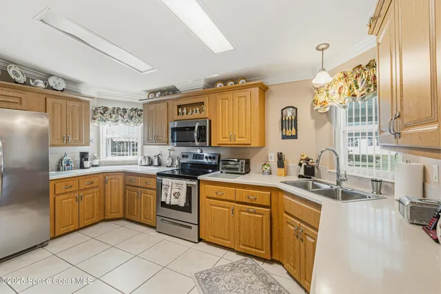 a kitchen with stainless steel appliances granite countertop a sink and cabinets