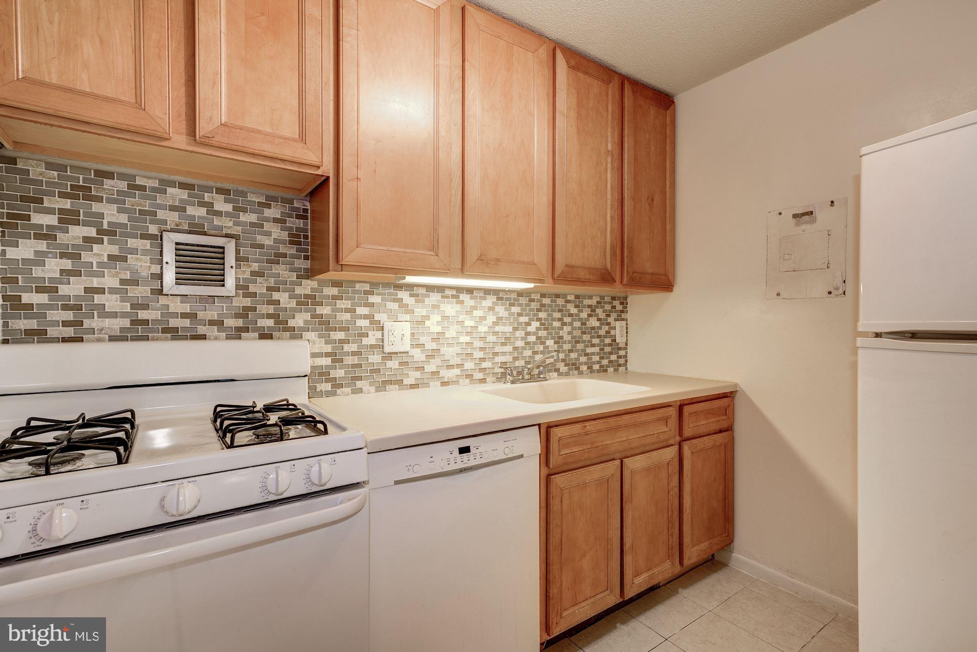 1301 20th Street Northwest, Unit 517 Washington, DC 20036 - Photo 7 of 14 a kitchen with a sink and cabinets