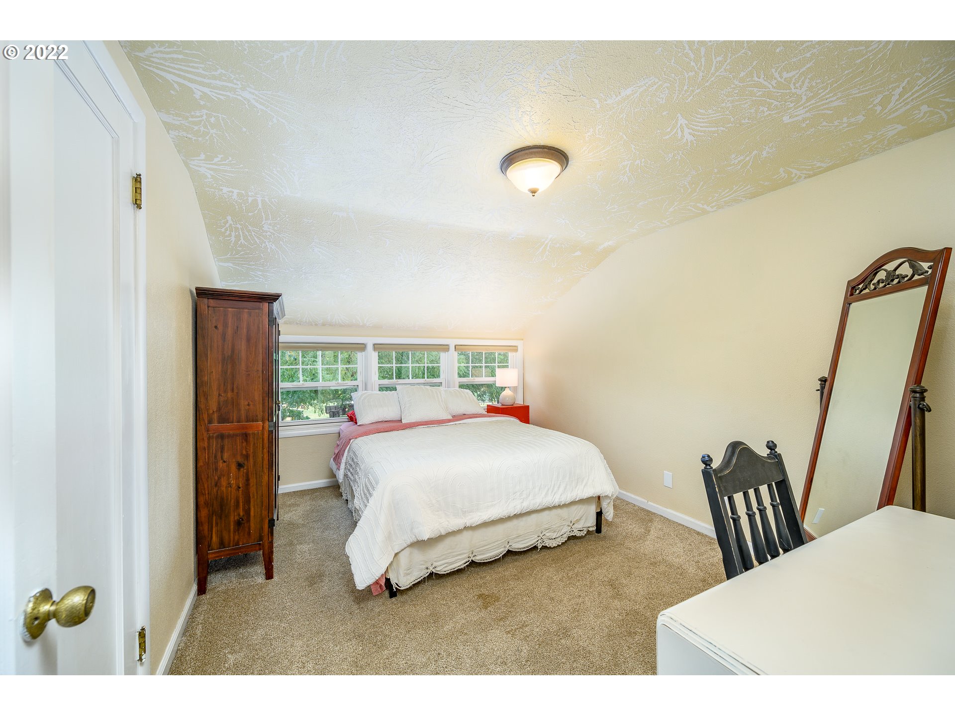 9851 Southwest Lancefield Road Amity, OR 97101 - Photo 13 of 32 a bedroom with a bed and wooden floor