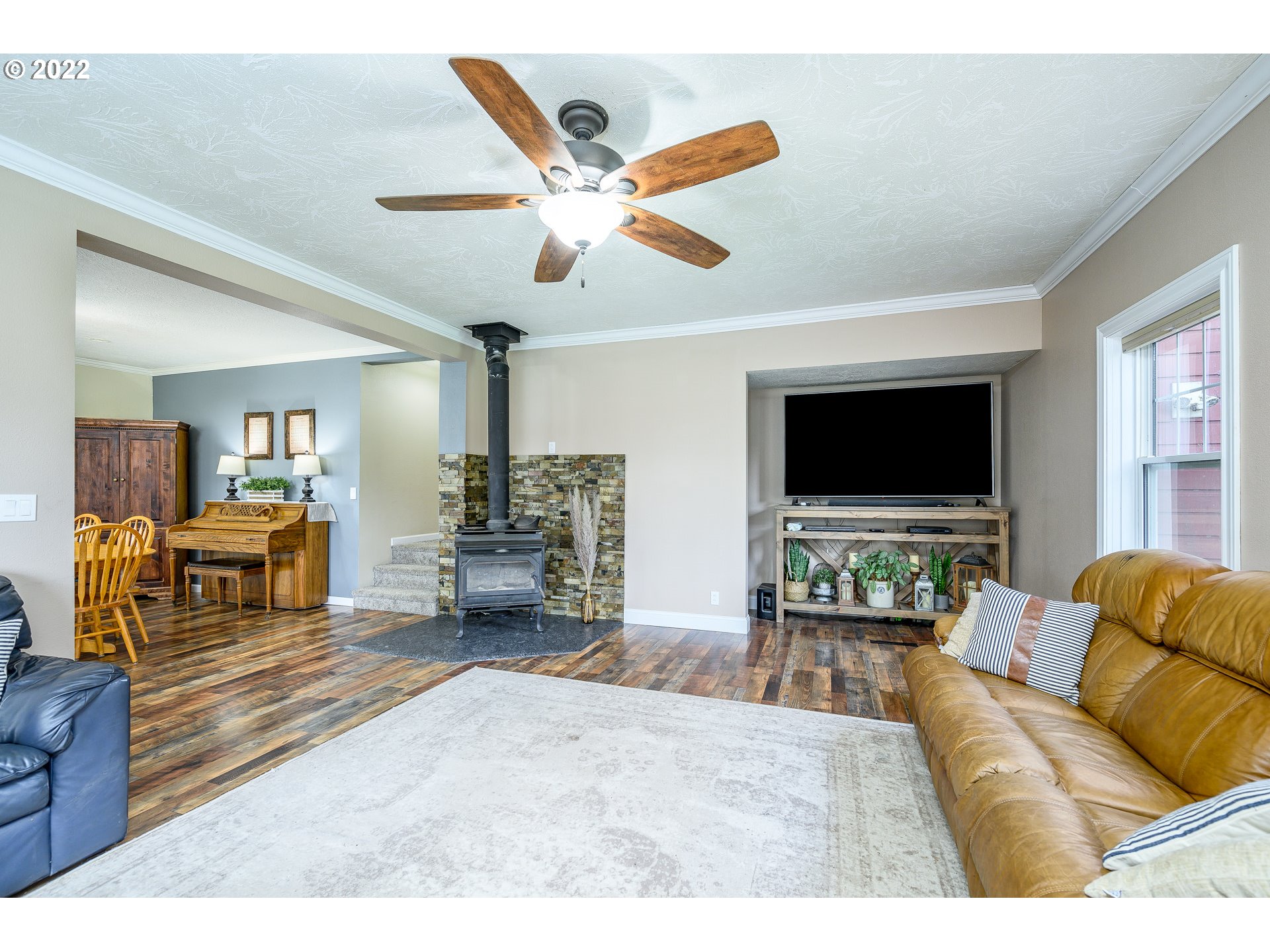 9851 Southwest Lancefield Road Amity, OR 97101 - Photo 10 of 32 a living room with furniture and a flat screen tv
