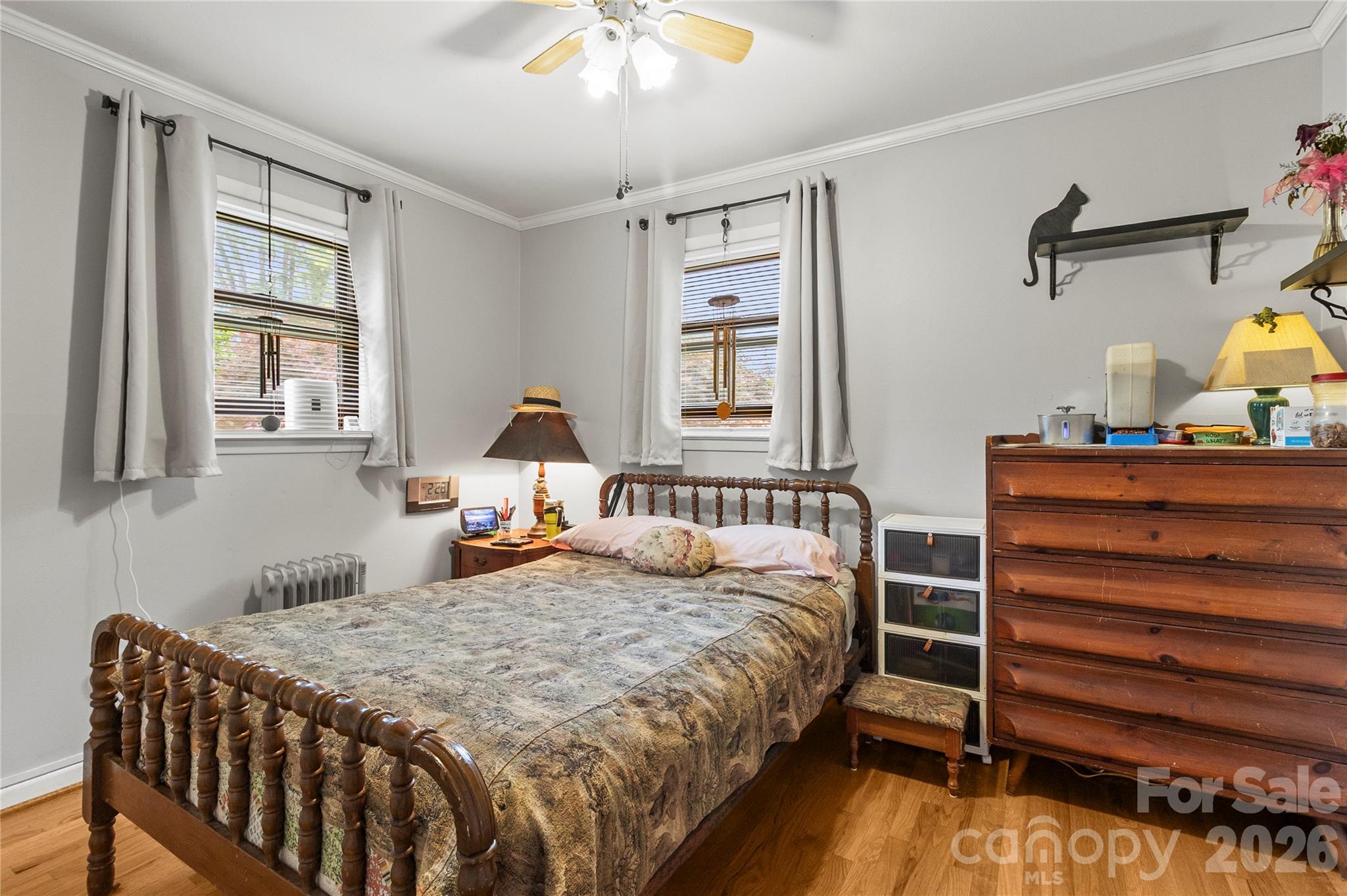 325 Swanson Road Lenoir, NC 28645 - Photo 20 of 35 a bedroom with a bed and wooden floor