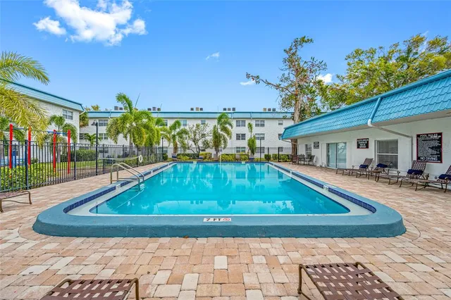 a view of swimming pool with a patio