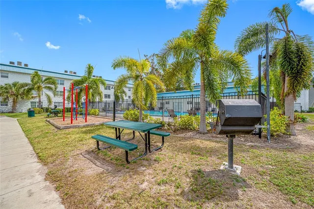 a view of a park with swings and slides
