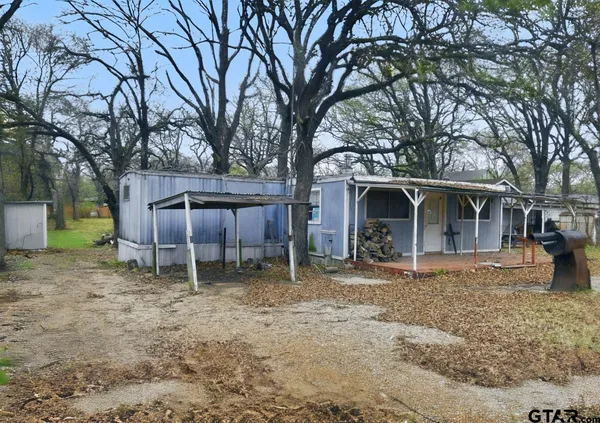 a spacious bedroom with a bed and a window