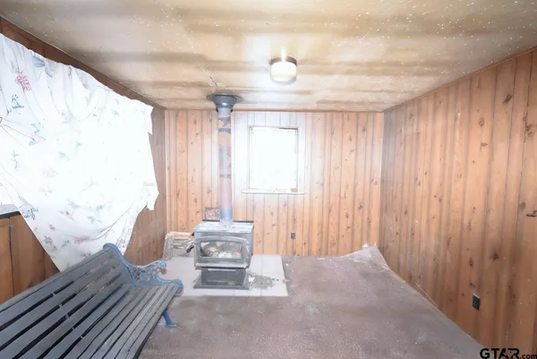 a view of a room with a furniture and a window