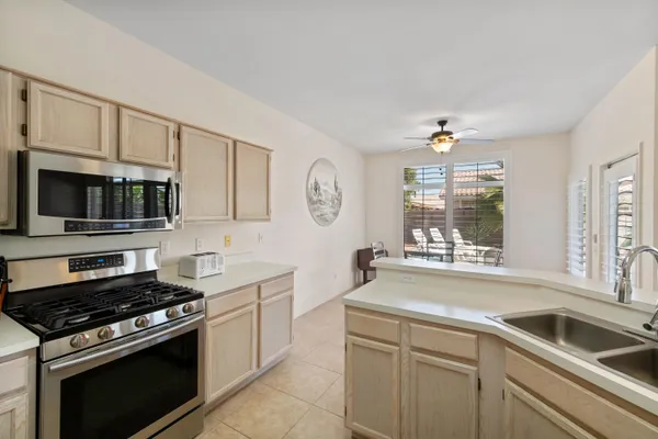 a kitchen that has a sink and a stove