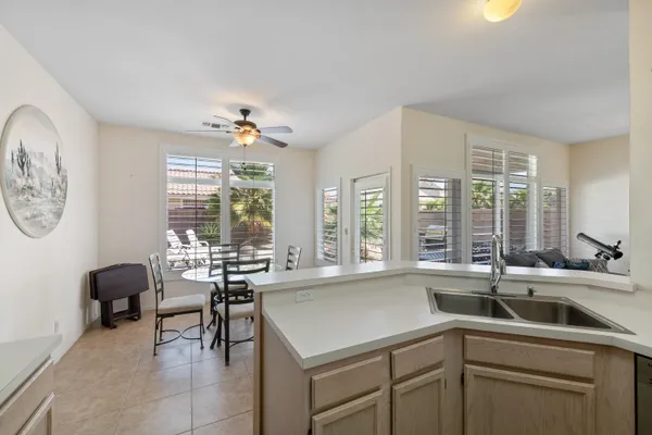 a view of a kitchen with a large window