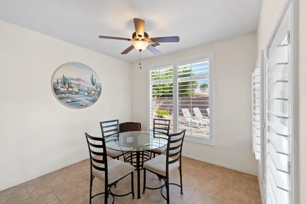 a view of a dining room with furniture window and outside view