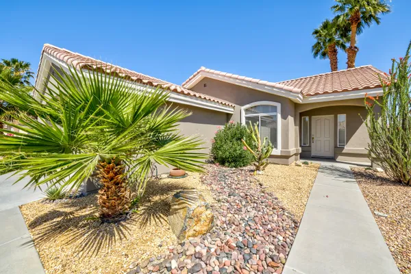 a view of a house with a street