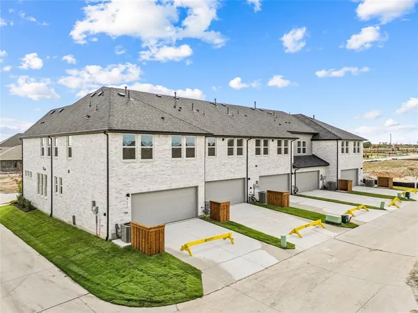 a view of a house with swimming pool and sitting area