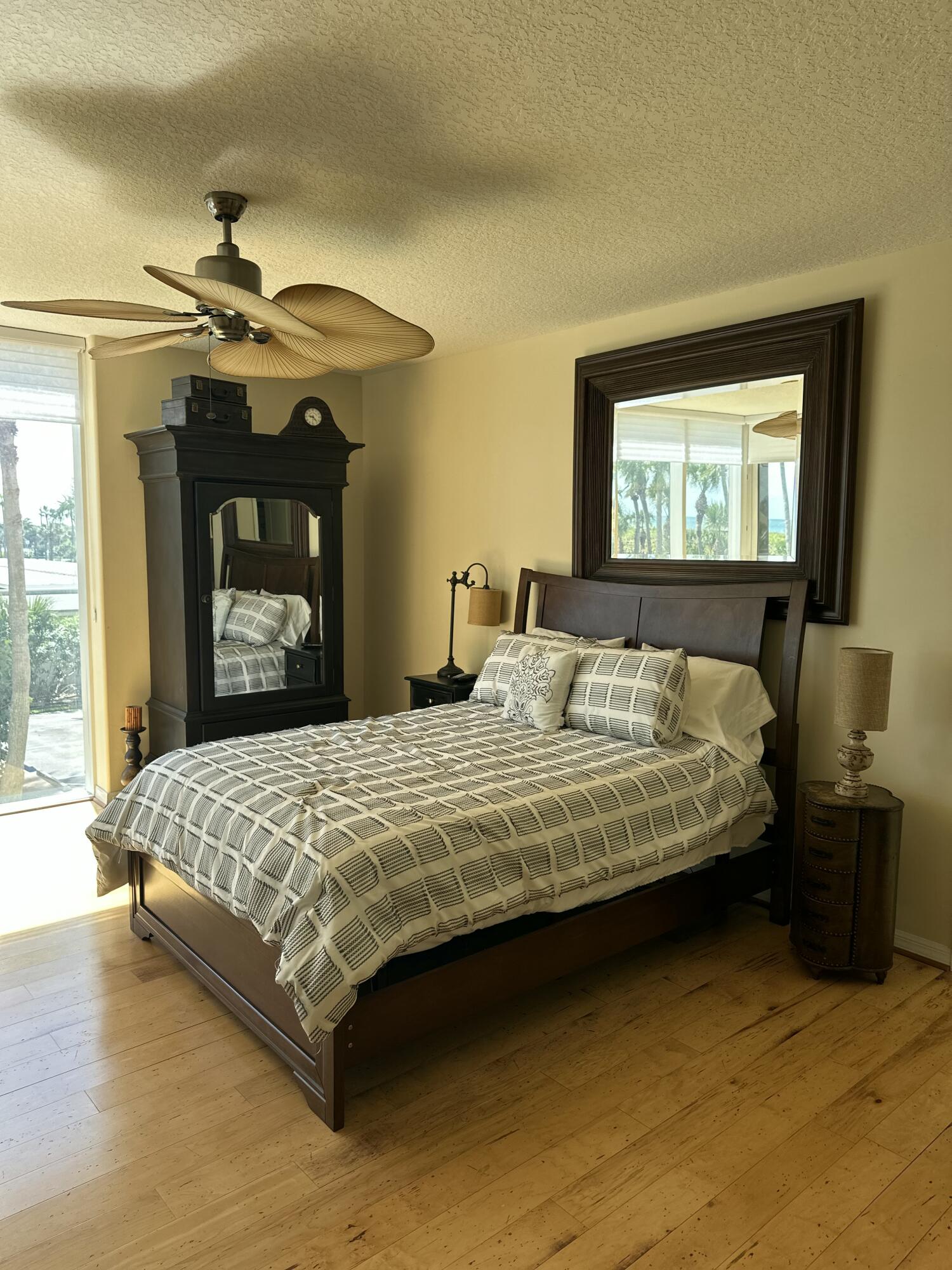 2900 North Hwy A1A, Unit 2 Fort Pierce, FL 34949 - Photo 11 of 34 a bedroom with a bed and a chandelier