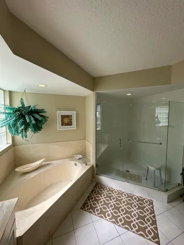 a bathroom with a bathtub and a shower