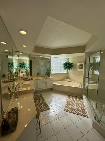 a bathroom with a bathtub and a shower